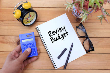 Business concept. notebook writing Review Budget