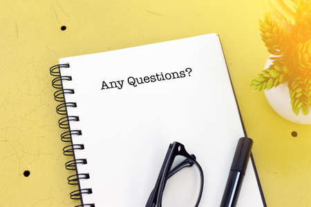 Top view notebook writing Any Questions?の写真素材