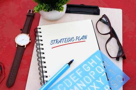 Top view notebook writing strategic plan