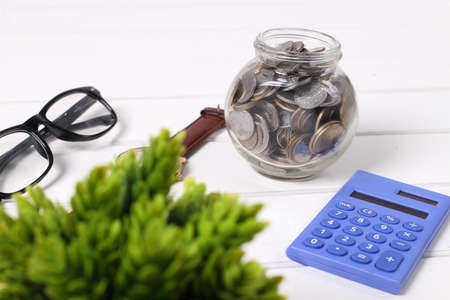 Money,coins in glass jar and saving concept