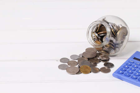 Money,coins in glass jar and saving conceptの写真素材