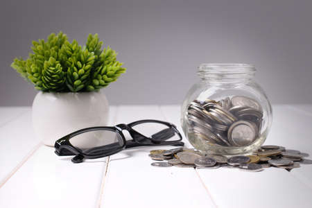 Money,coins in glass jar for saving conceptの写真素材