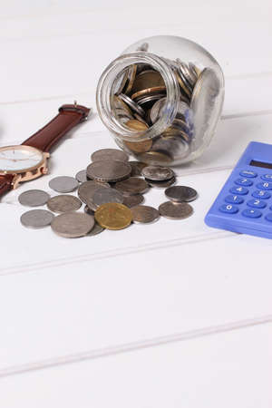 coin in glass jar