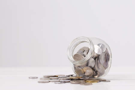 coin in glass jarの写真素材