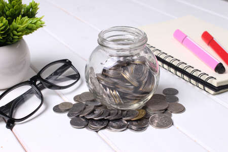 coin in glass jarの写真素材