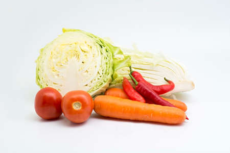 carrot with tomato isolated on whiteの写真素材