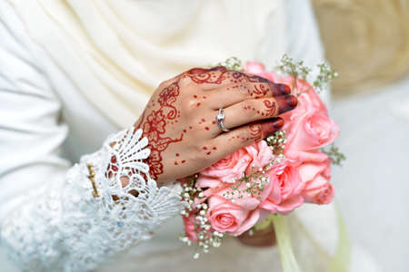Bride hand with bouquetの写真素材
