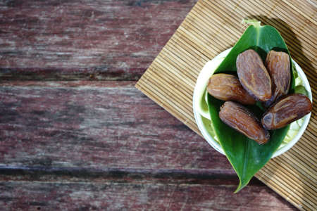 dates fruit on rustic wooden background