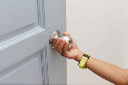 hands holding the door knobの写真素材