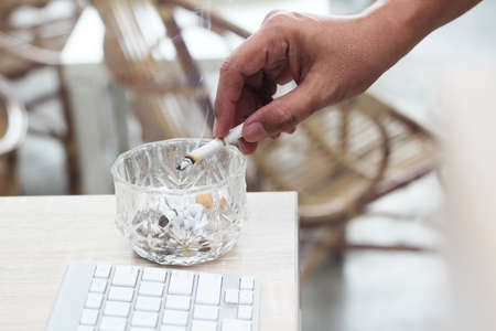 cigarette butts in glass containersの写真素材