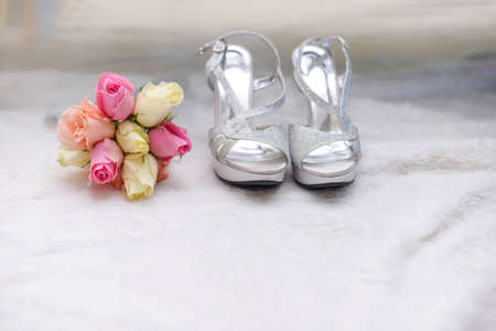 bouquet with wedding shoesの写真素材