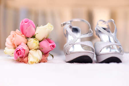 Bouquet with wedding shoesの写真素材