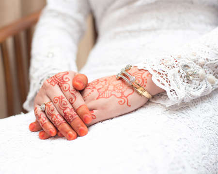 Beautiful hands of bride with unique henna designの写真素材