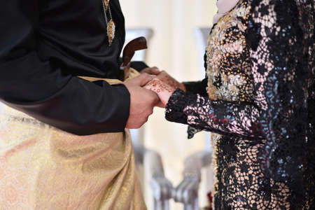 Bride holds handsの写真素材