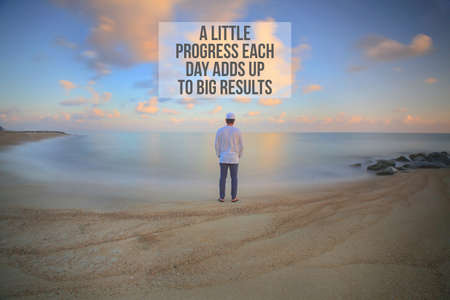 Inspirational motivation quotes on clouds blue sky background. A little progress each day adds up to big results.の写真素材