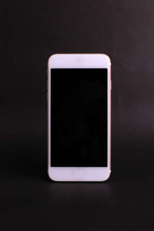 Blank smartphone on black background