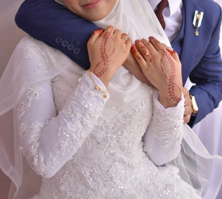 romantic wedding couple hug and holding handsの写真素材