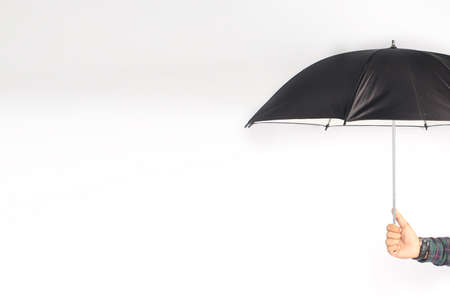 hand holding umbrella isolated on white backgroundの写真素材