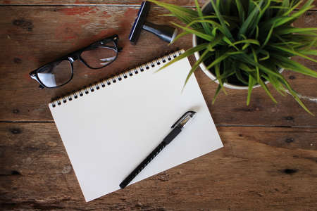 Design concept - Top view of orange and red spiral notebook and color pencil collection isolated on white background for mockupの写真素材