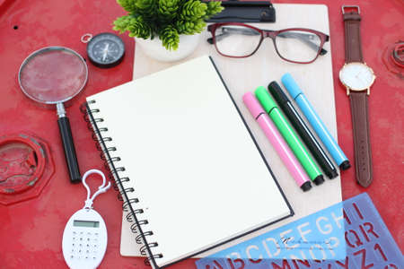 Top view blank notebook with glasses and pen