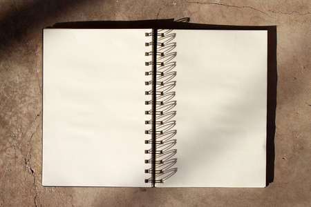 notebook on wooden desk background