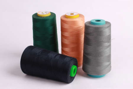 Colorful yarn on spool, yarn on tube, cotton, wool, linen thread
