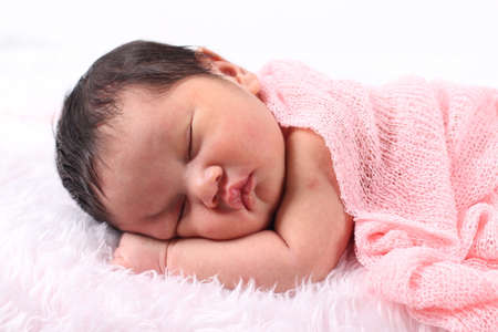 Cute newborn asian boy sleepingの写真素材