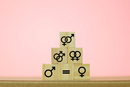 Gender inequality concept. Gender inequality concept. Male and female symbols on wooden cubes.の写真素材
