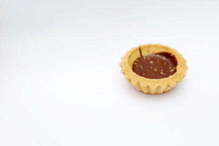 Chocolate tart on a white background, selective focus, copy spaceの写真素材