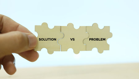 Concept of Solution vs problem with jigsaw puzzle pieces on white backgroundの写真素材