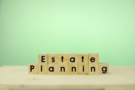 The word ESTATE PLANNING made of wooden blocks on a tableの写真素材