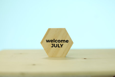 Welcome July wood cube on white background with copy space for text.の写真素材
