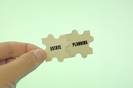 Jigsaw puzzle pieces with word ESTATE PLANNING, business concept imageの写真素材