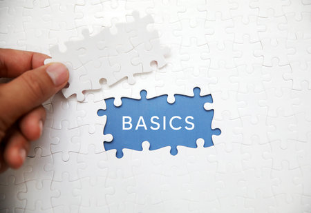Puzzle pieces with word BASICS. Business concept image.の写真素材