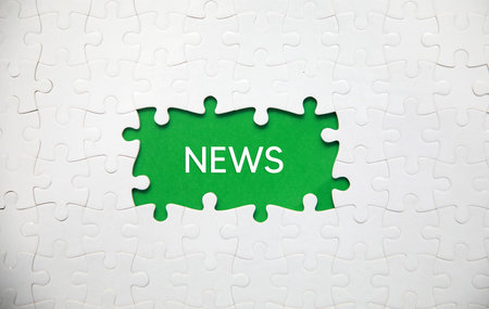 Missing piece of puzzle with word News. Business concept image for completing the puzzle.の写真素材
