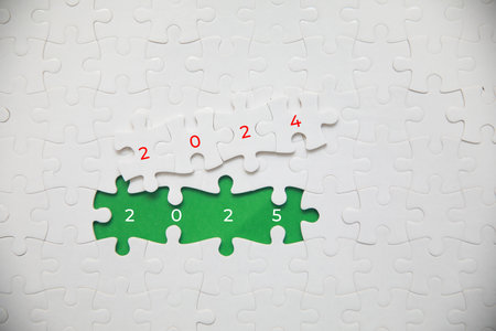 Jigsaw puzzle with 2011 year on green background. New year conceptの写真素材