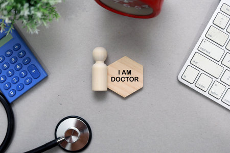 Wooden block with the word I AM DOCTOR, medical concept