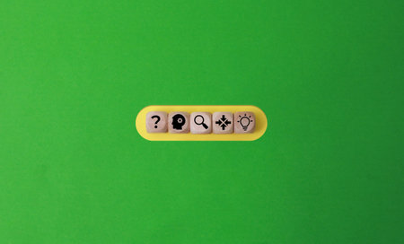 \The word \\love\\ written in wooden blocks on a green background.\