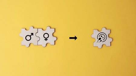 Conceptual image of two puzzle pieces with symbols of male and female gender.の写真素材