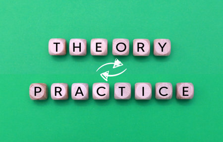 Conceptual image of a green background with wooden cubes and the textの写真素材