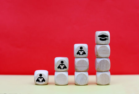 Conceptual image of a group of people on wooden cubes.の写真素材