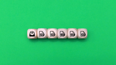 Wooden cubes with icons on green background. Business concept image.の写真素材