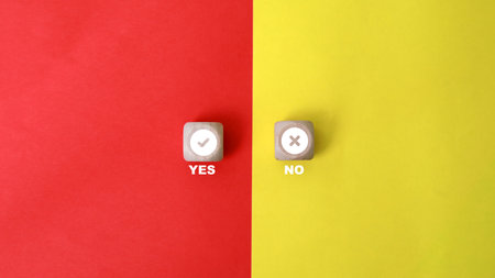 cubes with the word yes and no on a red and yellow backgroundの写真素材
