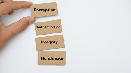 Business concept image of a businessman's hand holding wooden block with text on white background.の写真素材
