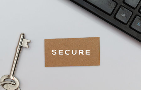 Key and paper tag with text SECURE on the white background.の写真素材