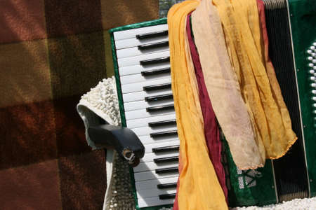 Old accordion in a spring gardenの写真素材