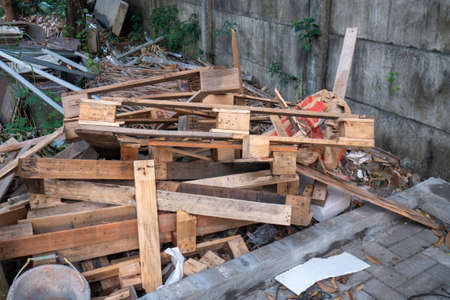 pile of scrap wood in a garden left over from home renovations