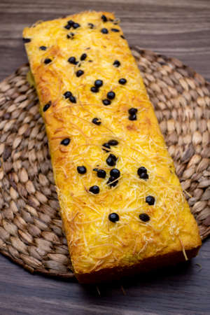 Rectange Cake Tape with Cheese, Indonesian Modern Food on woven wood on the wooden table