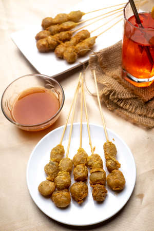 Homemade Cilor Favourite Street Food from Indonesia Made from Tapioca Flour and Egg. Decorated with red chili sauce and red syrupの写真素材