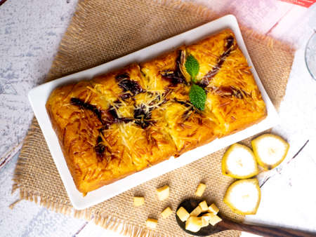 Pineapple bread, the typical food of the city of Tegal, Indonesia, decorated with banana and cheese...